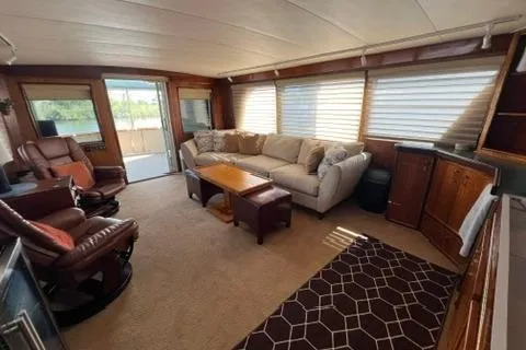 Slide: The Image of 1978 Hatteras 58 Motor Yacht interior with cozy seating and large windows. - 6