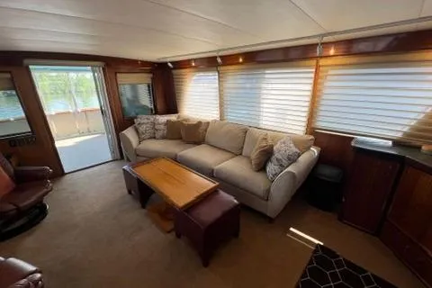 Slide: The Image of 1978 Hatteras 58 Motor Yacht interior with cozy seating and large windows. - 40