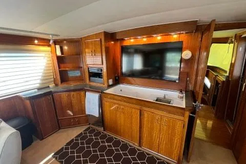 Slide: The Image of Interior of a 1978 Hatteras 58 Motor Yacht with wood cabinetry and modern amenities. - 39