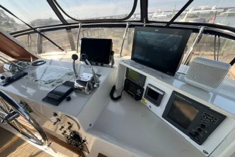 Slide: The Image of 1978 Hatteras 58 Motor Yacht helm with navigation equipment and controls. - 31