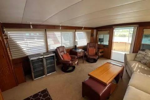 Slide: The Image of Interior of 1978 Hatteras 58 Motor Yacht with cozy seating and wooden accents. - 7