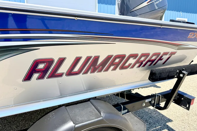 Slide: The Image of 2005 Alumacraft Tournament Sport 175 boat with bold logo on the side. - 8