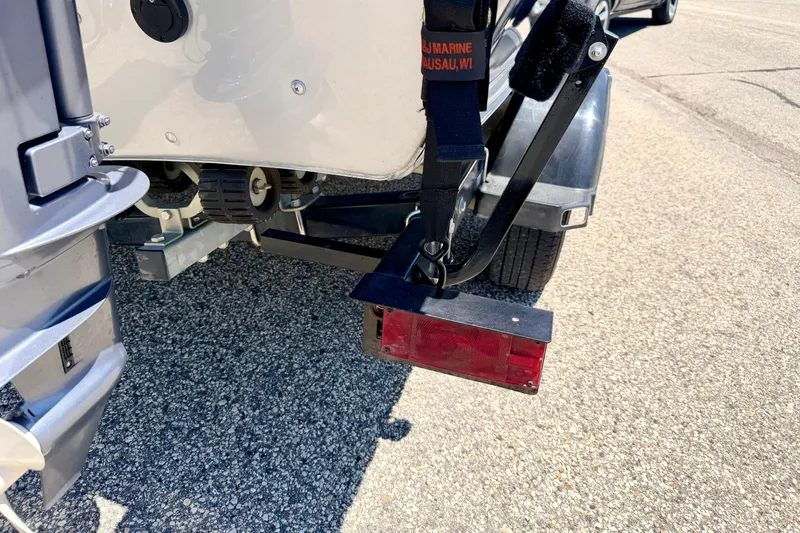Slide: The Image of Rear view of a 2005 Alumacraft Tournament Sport 175 boat trailer with red tail light. - 86