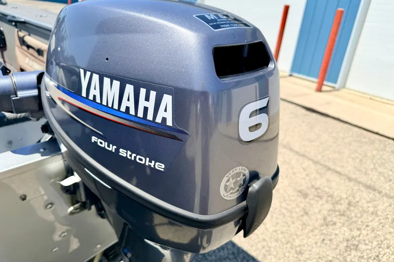 Slide: The Image of Yamaha 6 horsepower four-stroke outboard motor on 2005 Alumacraft Tournament Sport 175 boat. - 21