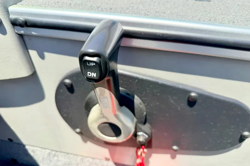 Slide: The Image of Close-up of a 2005 Alumacraft Tournament Sport 175 boat control lever. - 51