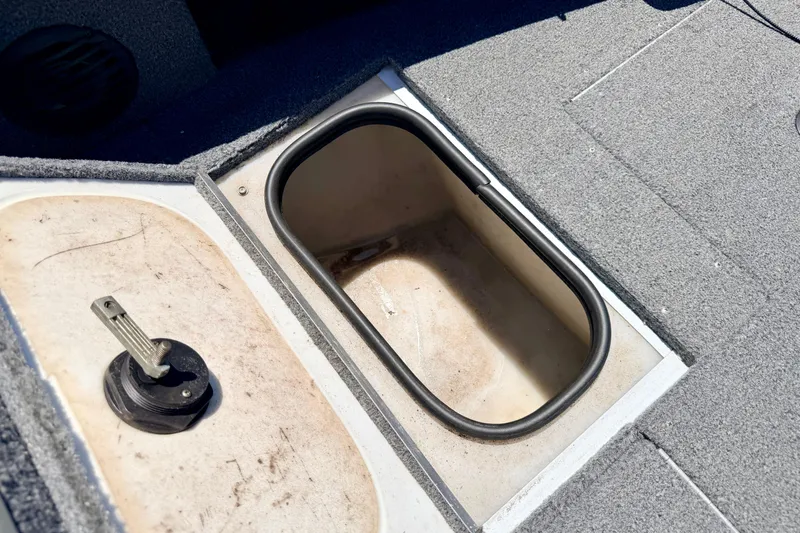 Slide: The Image of Open storage compartment in 2005 Alumacraft Tournament Sport 175 boat. - 62