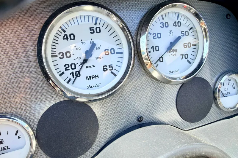 Slide: The Image of Dashboard gauges of a 2005 Alumacraft Tournament Sport 175 boat. - 46