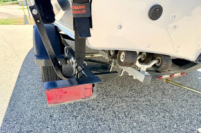 Slide: The Image of 2005 Alumacraft Tournament Sport 175 boat trailer with rollers and rear light assembly. - 85