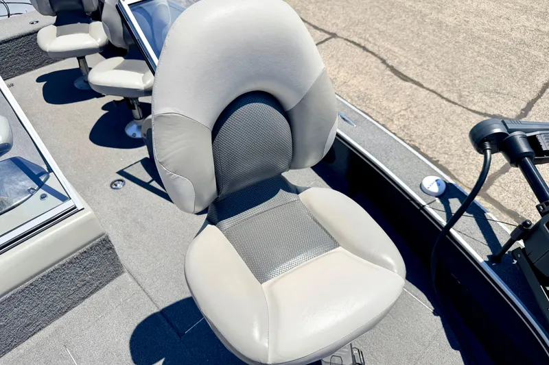 Slide: The Image of 2005 Alumacraft Tournament Sport 175 boat seat, gray upholstery, and fishing deck view. - 72