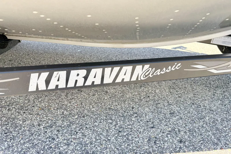 Slide: The Image of Karavan Classic trailer supporting a 2005 Alumacraft Tournament Sport 175 boat. - 80