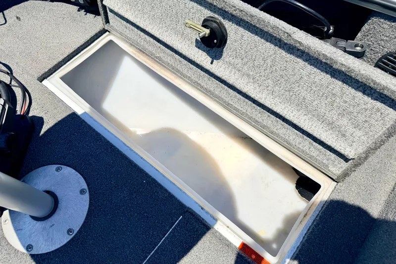 Slide: The Image of Storage compartment in a 2005 Alumacraft Tournament Sport 175 boat, open and empty. - 66