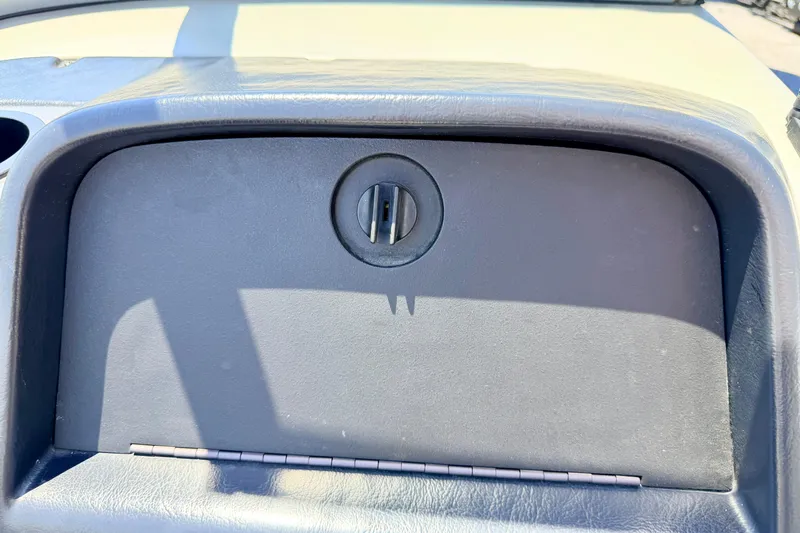 Slide: The Image of Dashboard compartment of a 2005 Alumacraft Tournament Sport 175 boat. - 39