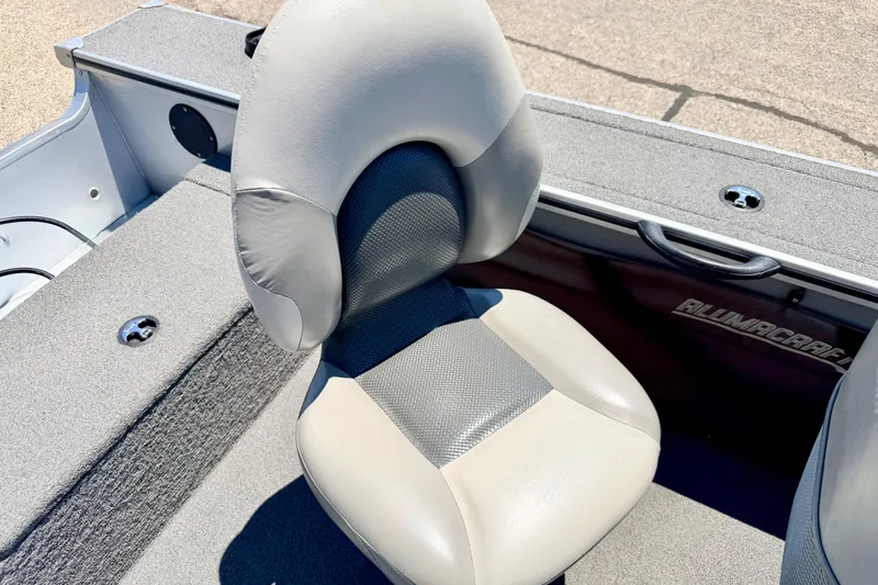 Slide: The Image of 2005 Alumacraft Tournament Sport 175 boat seat, gray upholstery, and carpeted deck. - 36