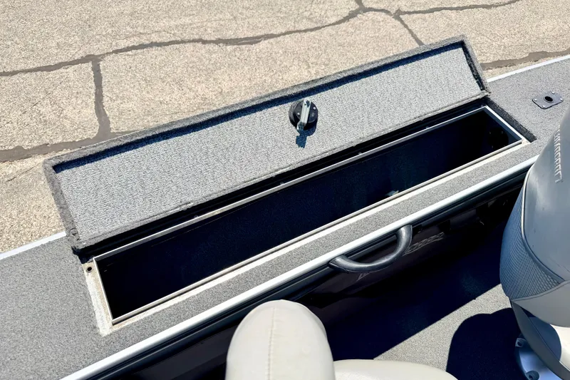 Slide: The Image of Open storage compartment in a 2005 Alumacraft Tournament Sport 175 boat. - 55