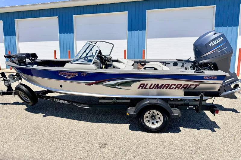 Slide: The Image of 2005 Alumacraft Tournament Sport 175 boat with Yamaha motor on trailer. - 2