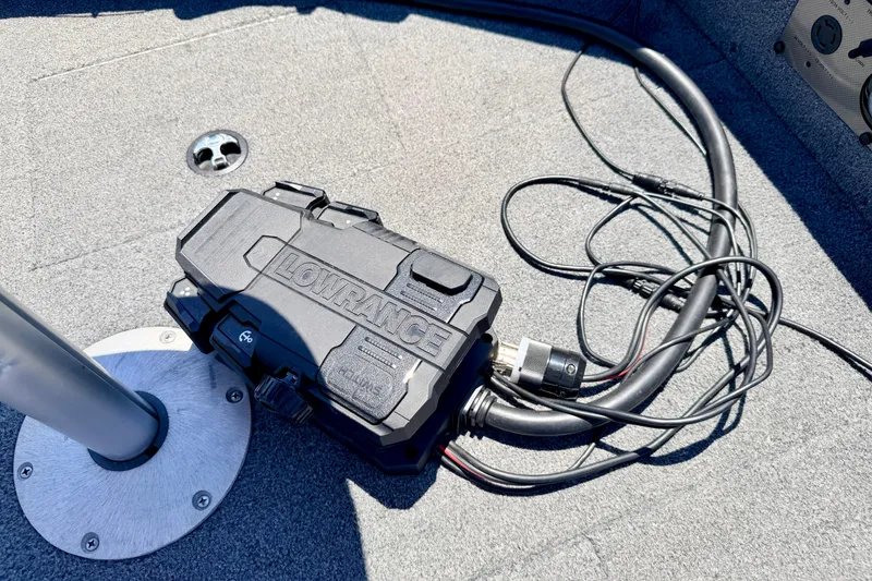 Slide: The Image of Lowrance device on 2005 Alumacraft Tournament Sport 175 boat deck with cables. - 69