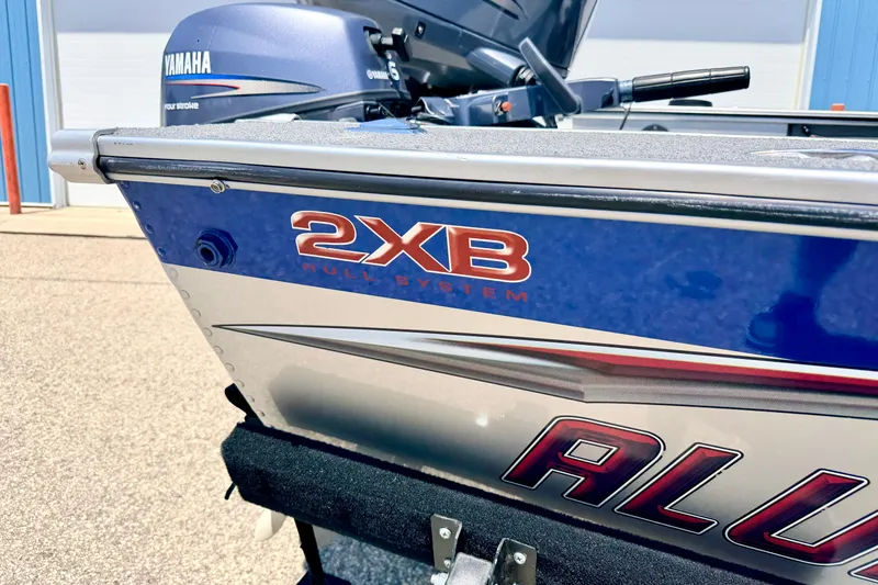 Slide: The Image of 2005 Alumacraft Tournament Sport 175 boat with Yamaha motor, featuring 2XB hull system. - 14