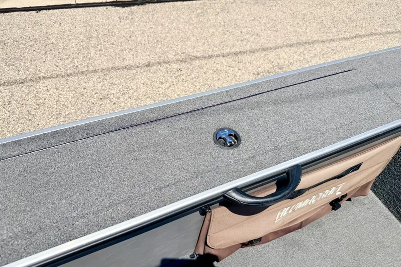 Slide: The Image of 2005 Alumacraft Tournament Sport 175 boat interior with carpeted surface and storage compartment. - 53