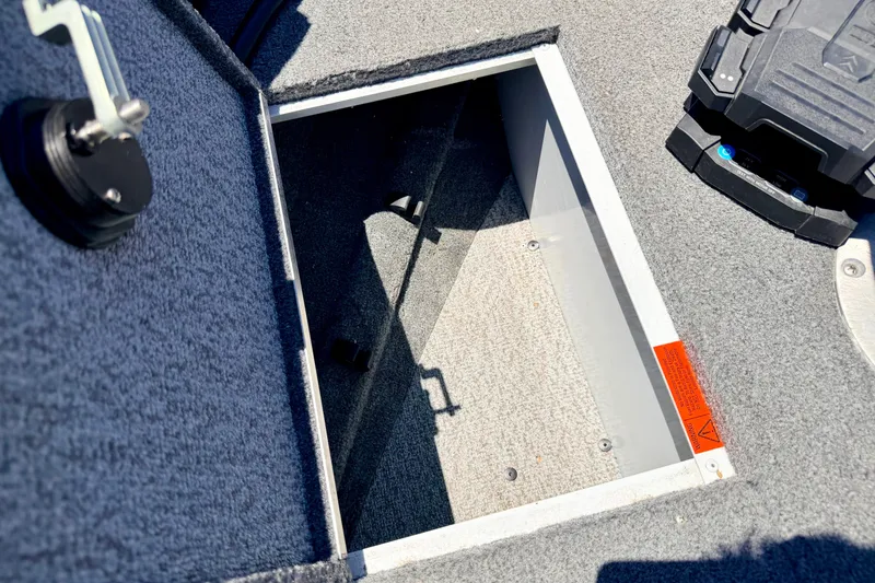 Slide: The Image of Open storage compartment in 2005 Alumacraft Tournament Sport 175 boat interior. - 64