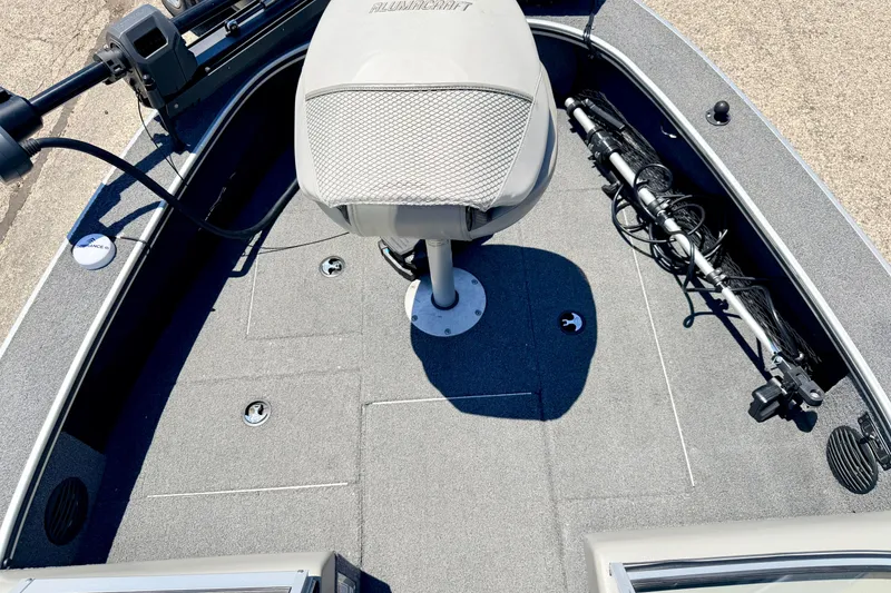 Slide: The Image of 2005 Alumacraft Tournament Sport 175 boat deck with seat and fishing equipment. - 61