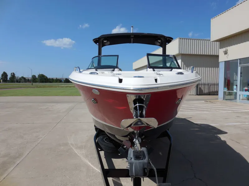 Slide: The Image of A red 2020 Chaparral 277 SSX boat on a trailer in a parking lot. - 9