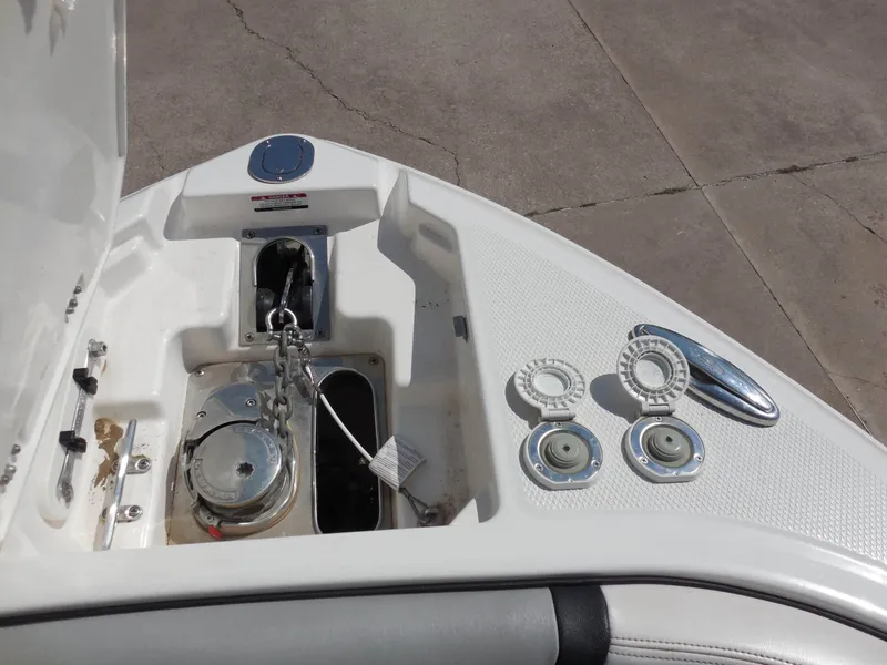Slide: The Image of The bow of a 2020 Chaparral 277 SSX with anchor windlass and deck fittings. - 21