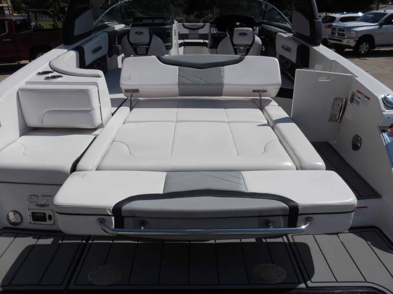 Slide: The Image of The image shows the cockpit of a 2020 Chaparral 277 SSX with white upholstery and gray accents. - 13