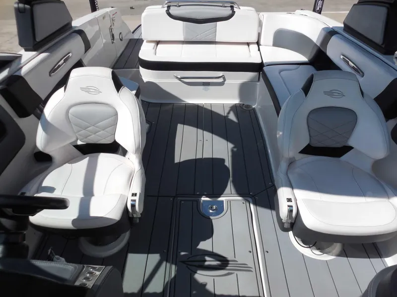 Slide: The Image of The image shows the cockpit of a 2020 Chaparral 277 SSX with sleek white seating. - 24