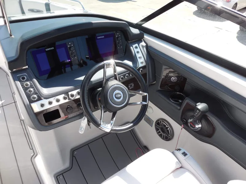 Slide: The Image of The image shows the cockpit of a 2020 Chaparral 277 SSX with modern instruments and a sleek steering wheel. - 15