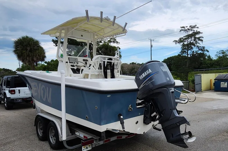 Slide: The Image of 2007 Edgewater 228CC boat on trailer with Yamaha outboard motor in parking lot. - 4