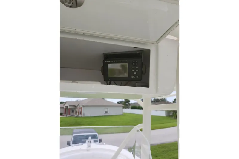 Slide: The Image of 2007 Edgewater 228CC boat with electronic navigation system in console. - 14