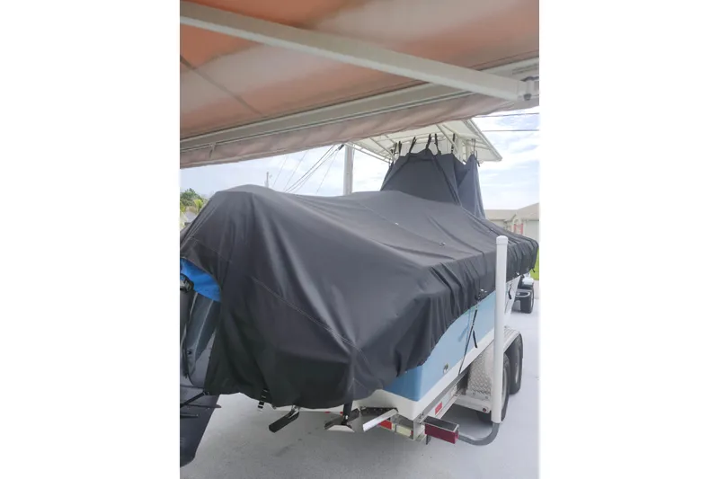 Slide: The Image of Covered 2007 Edgewater 228CC boat on trailer under shelter. - 10