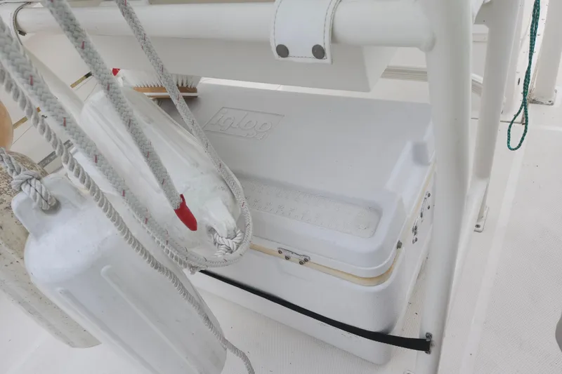 Slide: The Image of Boat deck with Igloo cooler and ropes on a 2007 Edgewater 228CC. - 32