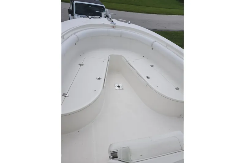Slide: The Image of 2007 Edgewater 228CC boat interior with spacious seating and storage compartments. - 21