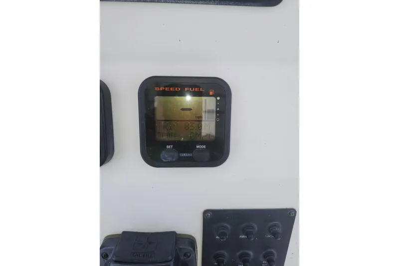 Slide: The Image of Yamaha speed and fuel gauge on 2007 Edgewater 228CC boat dashboard. - 19