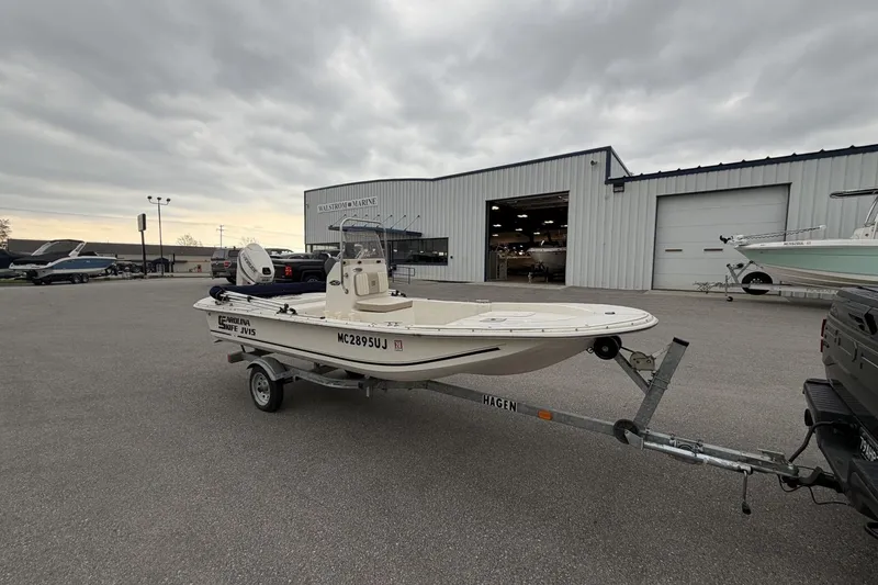 Slide: The Image of 2014 Carolina Skiff JV15CC boat on trailer outside marine dealership. - 6