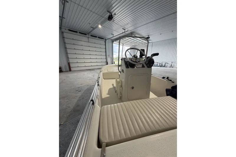 Slide: The Image of 2014 Carolina Skiff JV15CC boat interior in a spacious garage setting. - 4