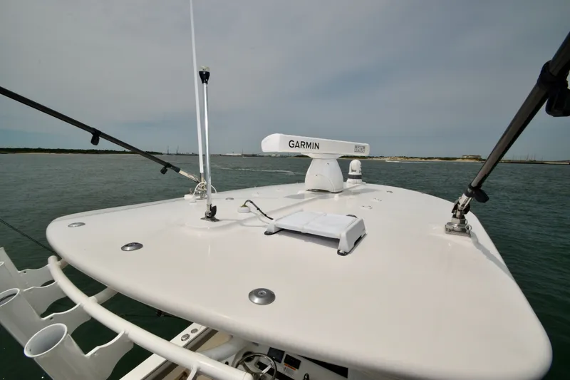 Slide: The Image of The image shows the bow of a Regulator 28 Forward Seating boat with Garmin equipment. - 26