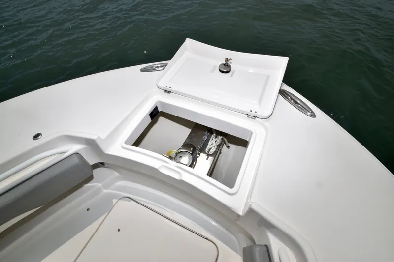 Slide: The Image of The image shows the bow of a boat with an open anchor locker containing an anchor. - 18