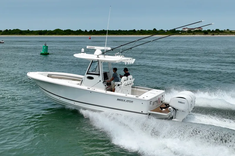 Slide: The Image of A white motorboat speeding on the water with two people on board. - 15