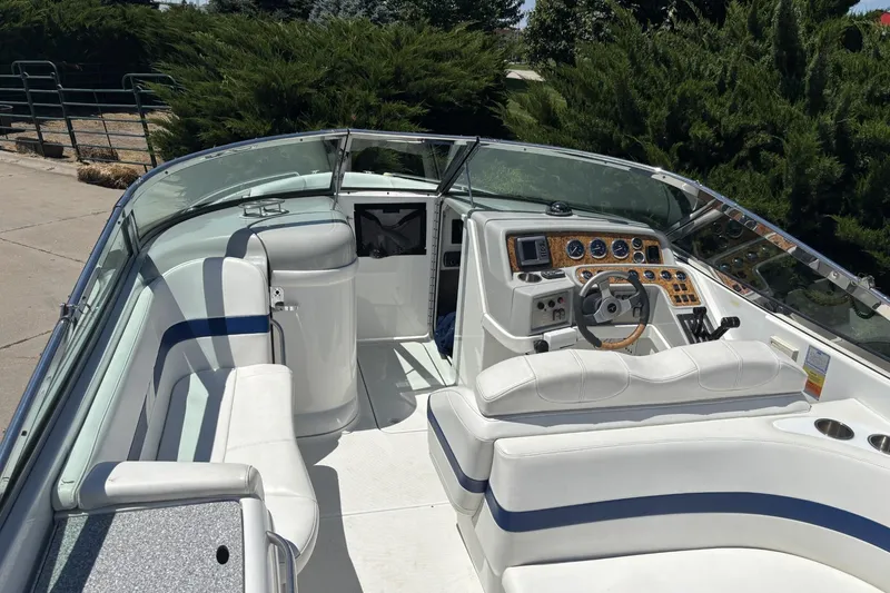 Slide: The Image of 2007 Formula 280 Bowrider boat interior with white seating and modern dashboard controls. - 10