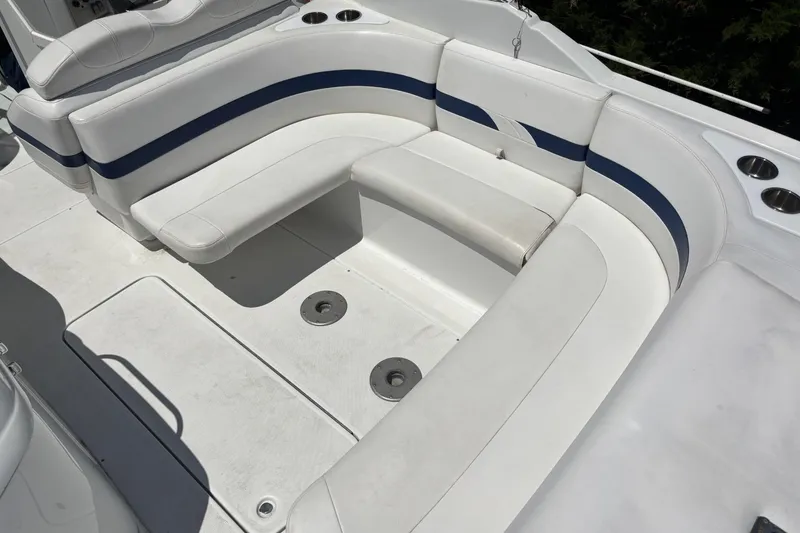 Slide: The Image of 2007 Formula 280 Bowrider boat interior with white and blue seating arrangement. - 9