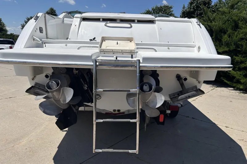 Slide: The Image of Rear view of a 2007 Formula 280 Bowrider boat with dual propellers and ladder. - 8