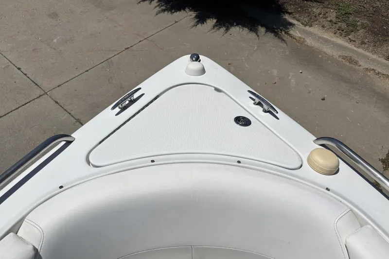 Slide: The Image of Bow of a 2007 Formula 280 Bowrider boat with white seating and deck details. - 22