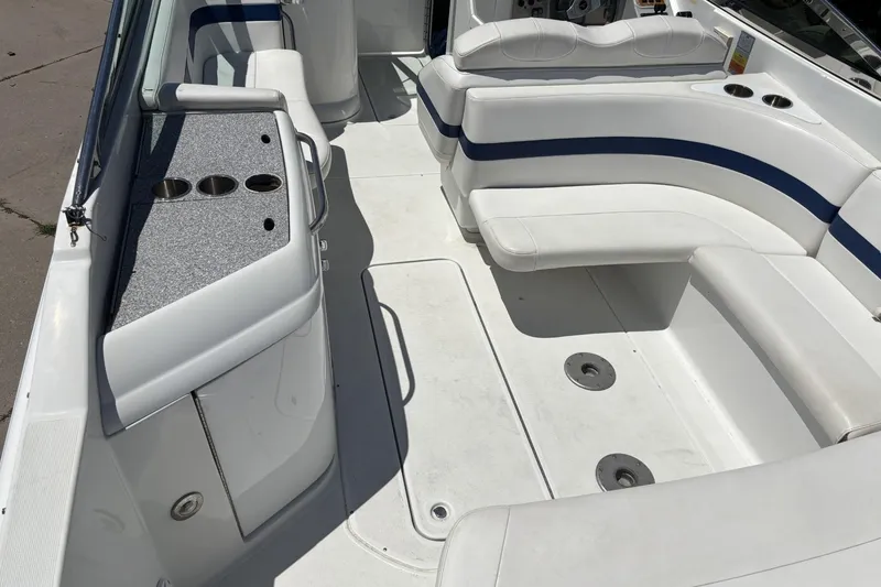Slide: The Image of 2007 Formula 280 Bowrider interior with white seating and cup holders. - 11