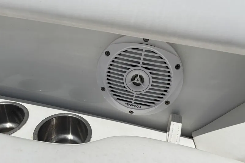 Slide: The Image of Kenwood speaker and cup holders on 2007 Formula 280 Bowrider boat interior. - 21