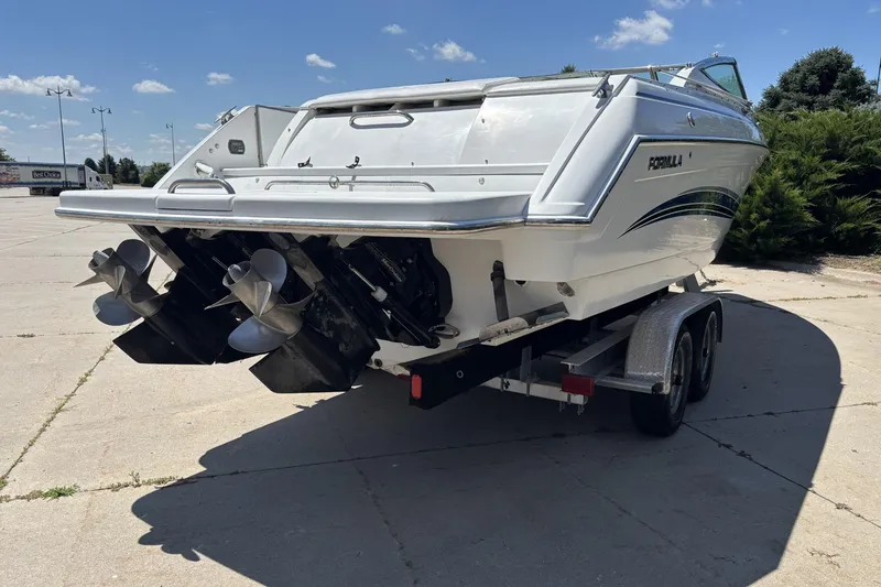 Slide: The Image of 2007 Formula 280 Bowrider boat on trailer, dual propellers, sunny day. - 5