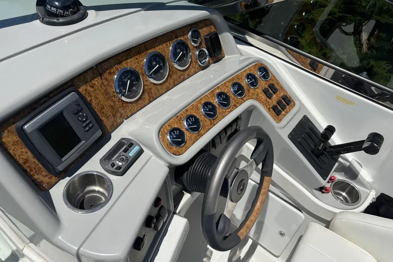 Slide: The Image of 2007 Formula 280 Bowrider dashboard with gauges, steering wheel, and control panel. - 14