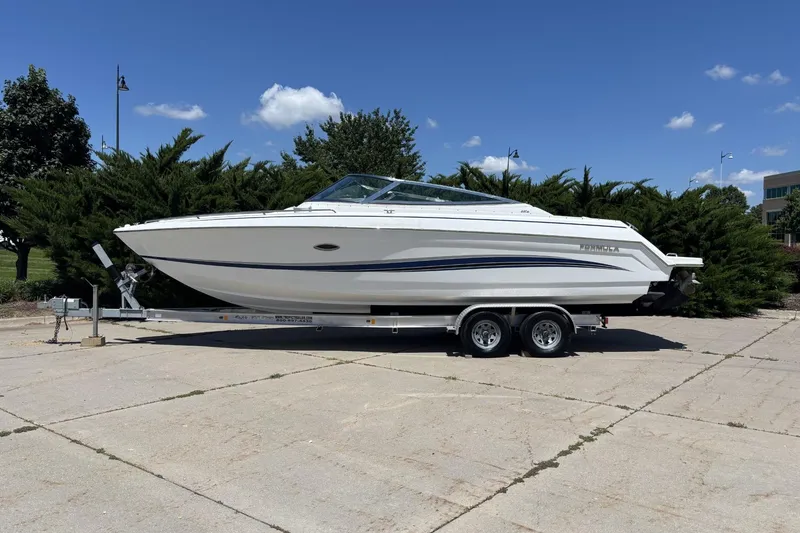 Slide: The Image of 2007 Formula 280 Bowrider boat on trailer, parked outdoors under blue sky. - 1