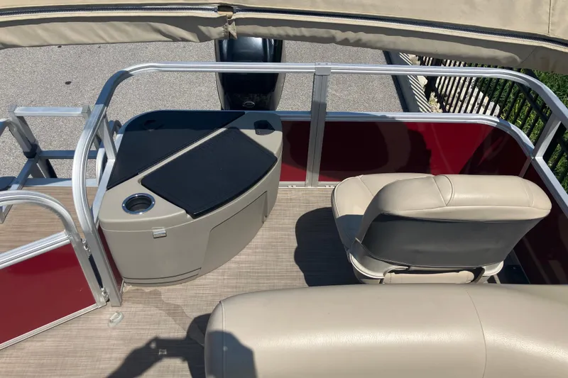 Slide: The Image of 2020 Sun Tracker Bass Buggy 18 DLX interior with seating and console. - 9